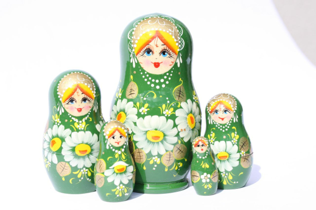 A 5 Nested set of Artists Matryoshka, Green girl with white flowers