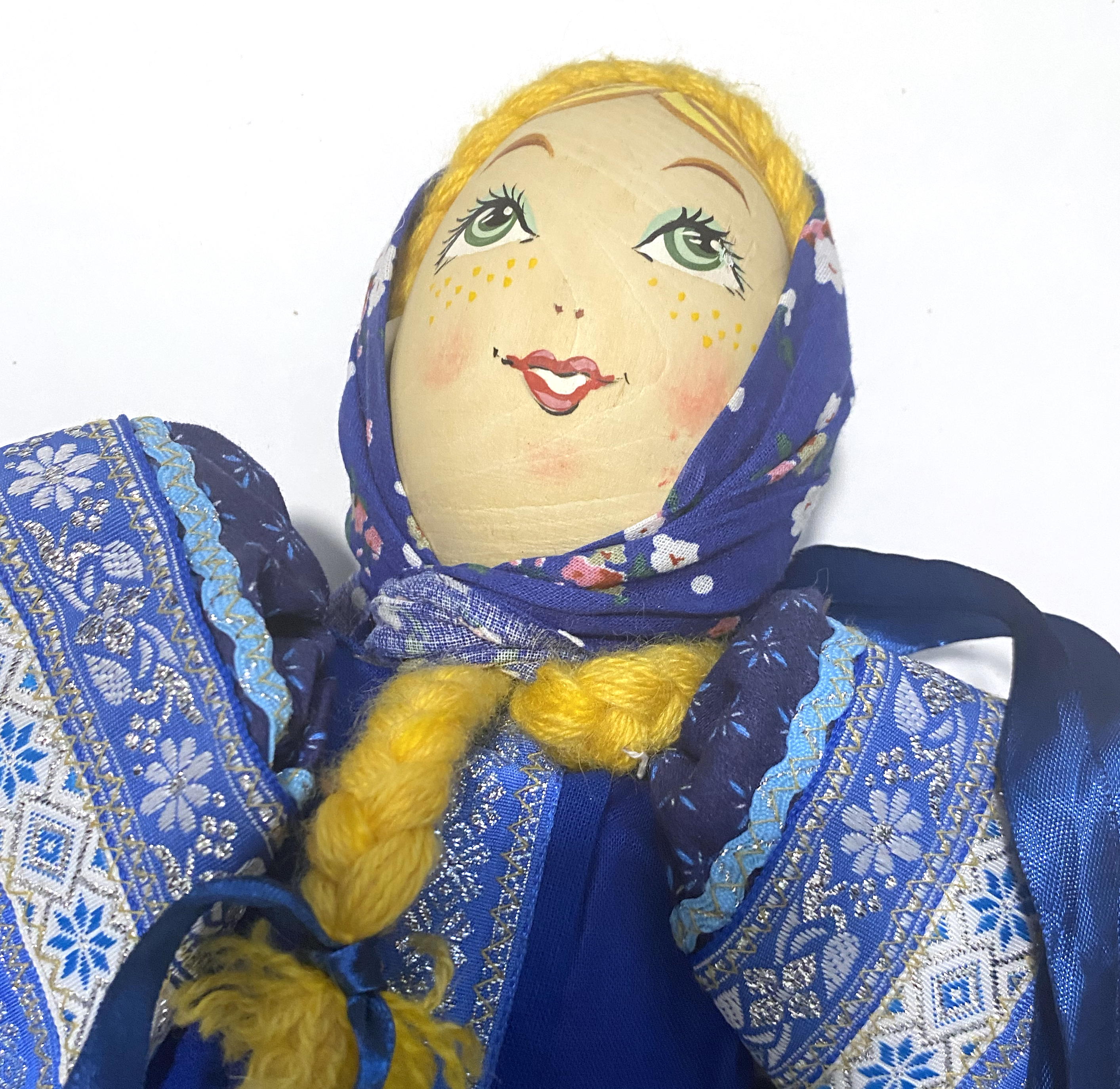 Cloth doll with wooden face, blue gzel